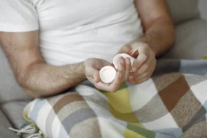 man taking a pill