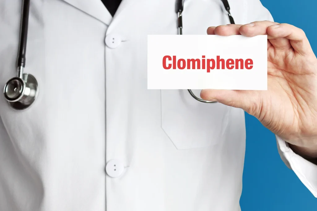 a doctor holding a card with clomiphene written on it